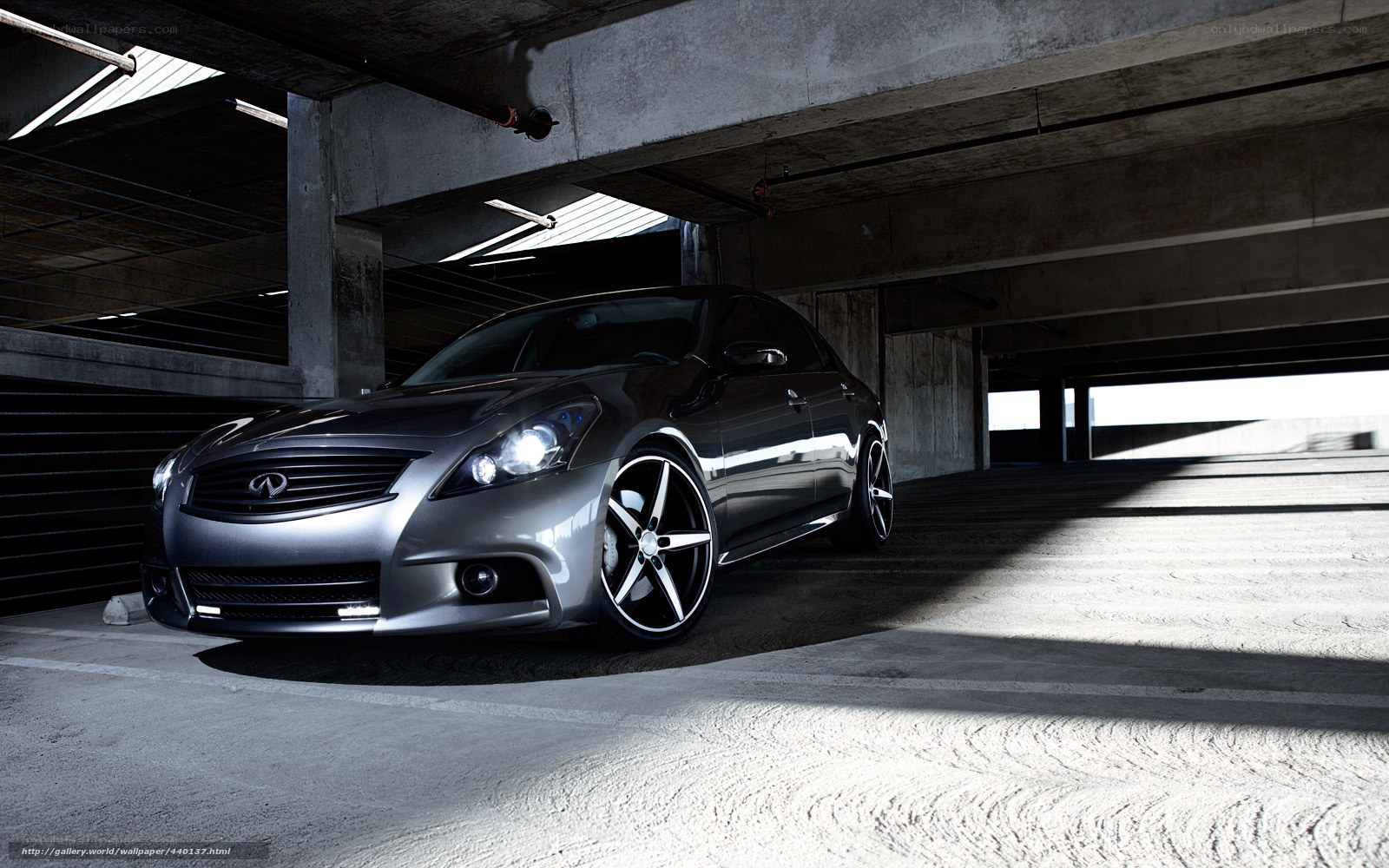 Silver Infiniti in parking garage