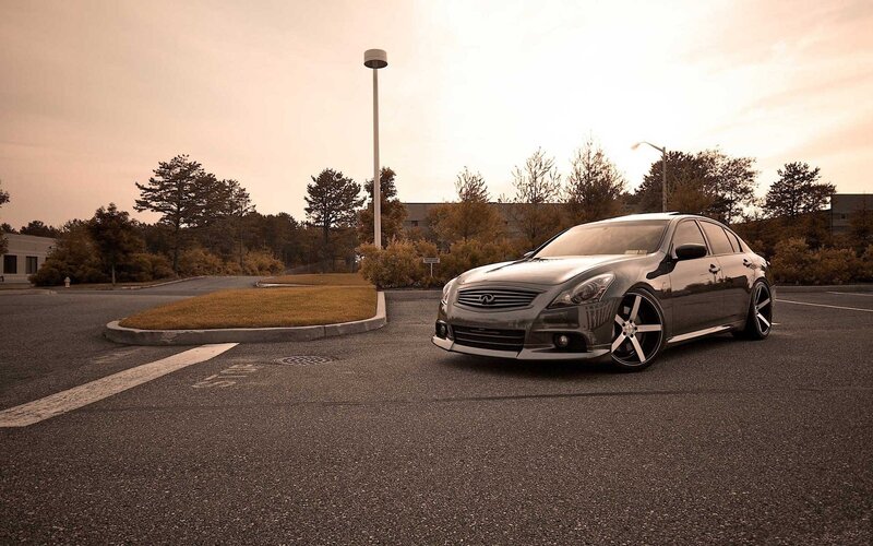 silver infiniti in parking lot