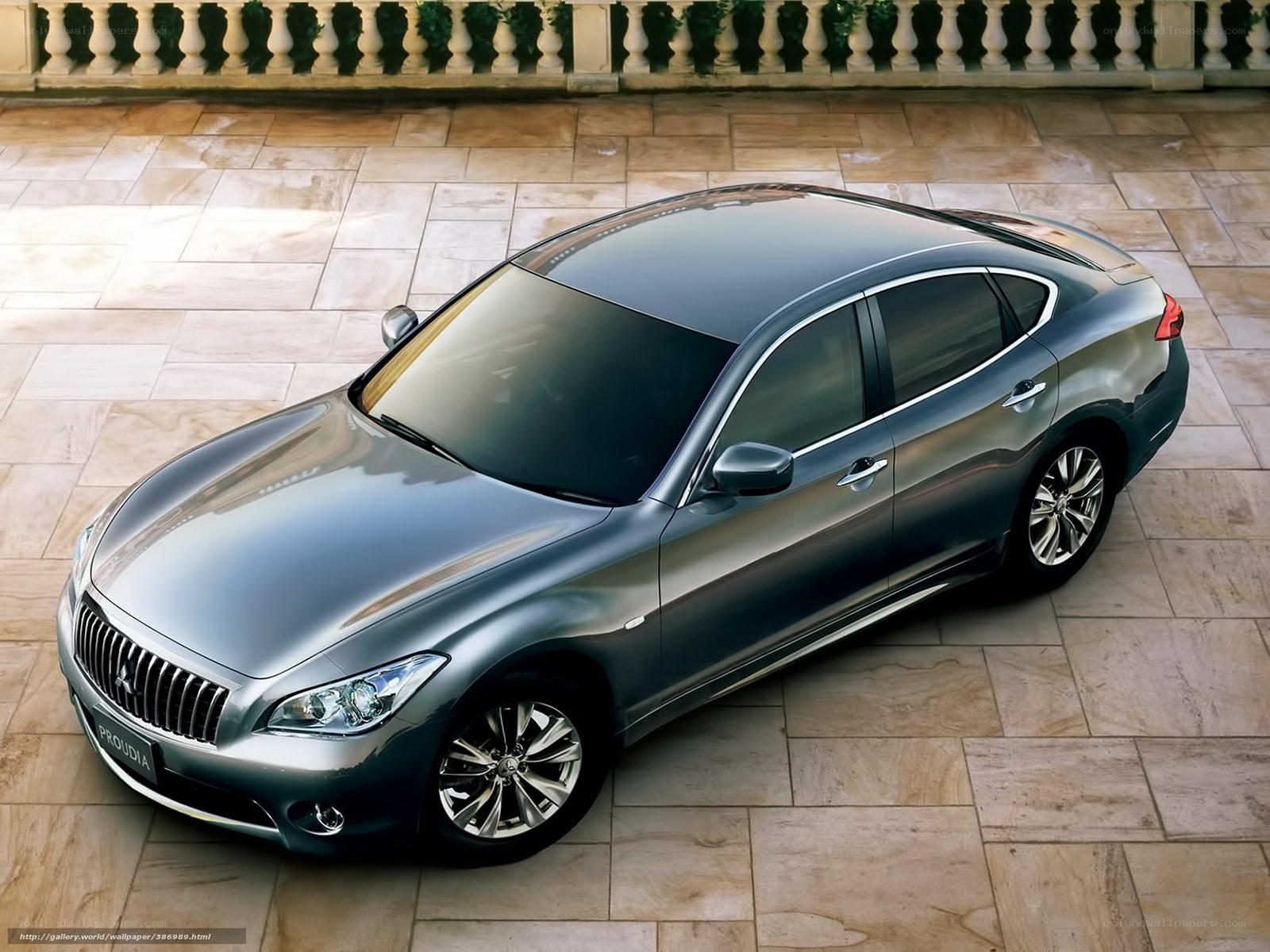 Silver Infiniti sedan on stone patio