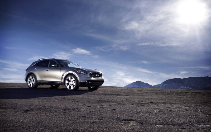 silver infiniti suv on desert road