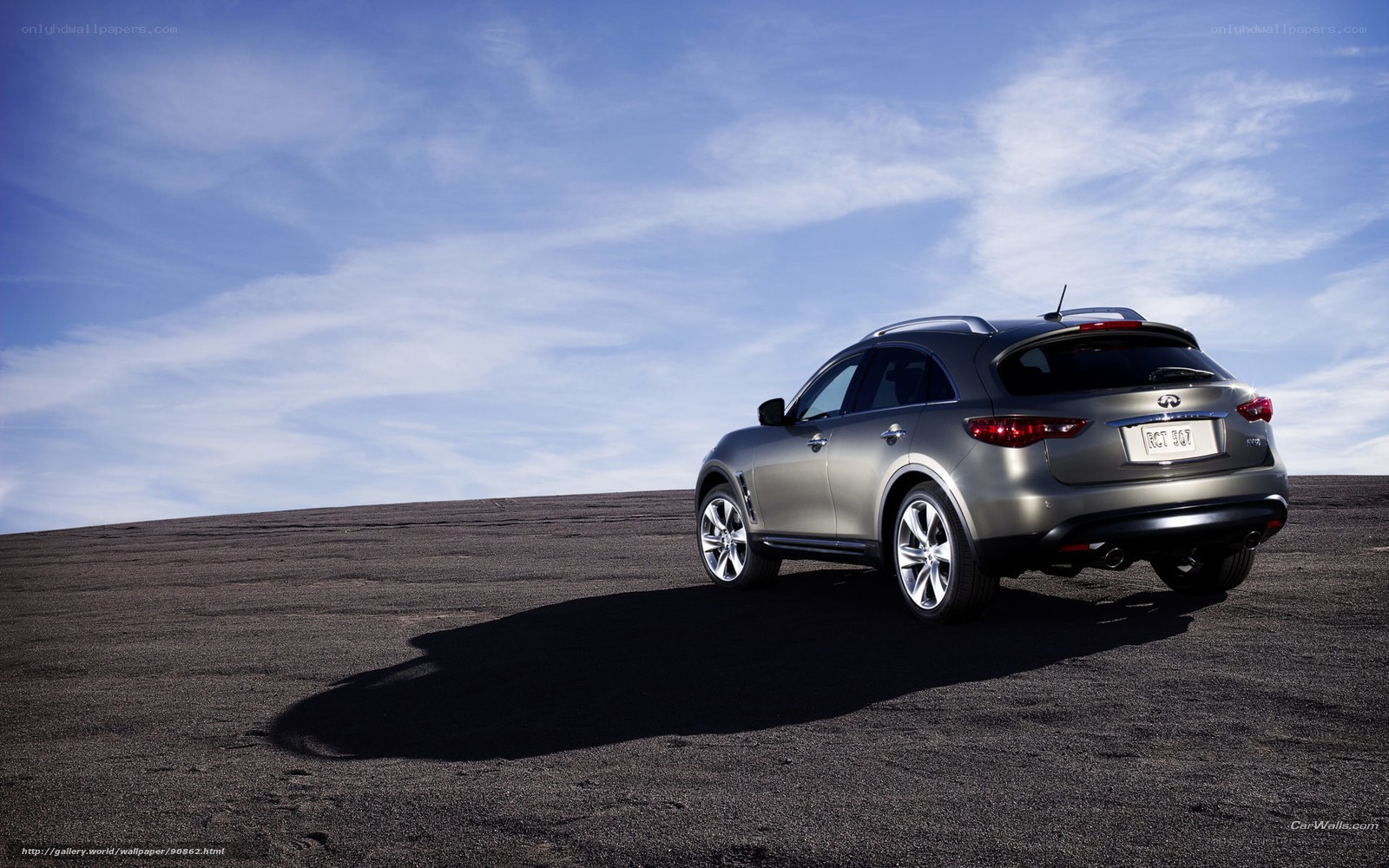 silver infiniti suv on desert road