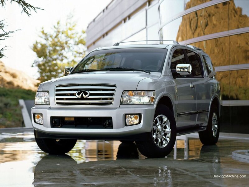silver infiniti suv on wet pavement