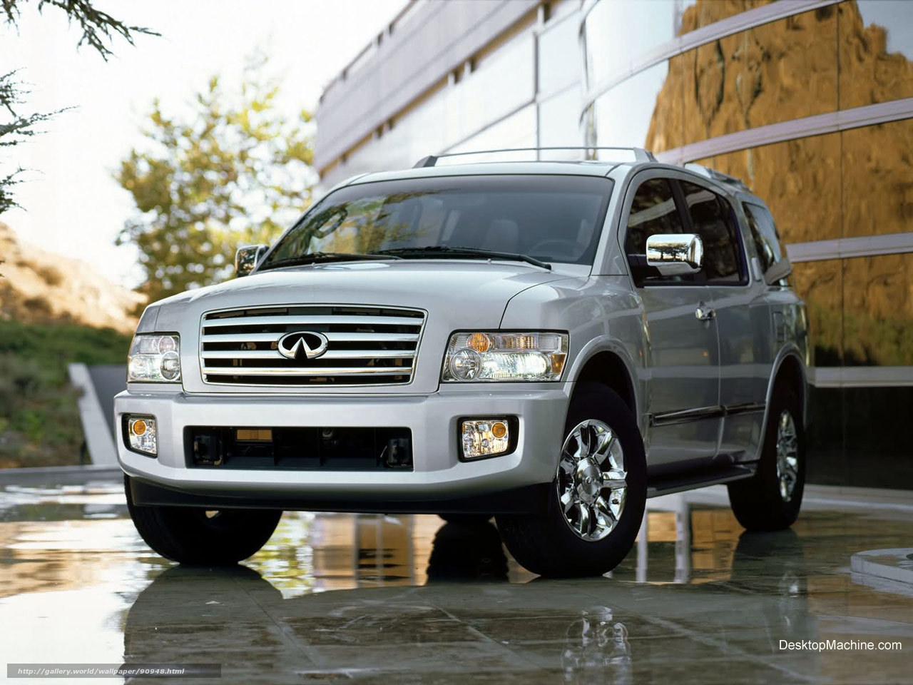 silver infiniti suv on wet pavement