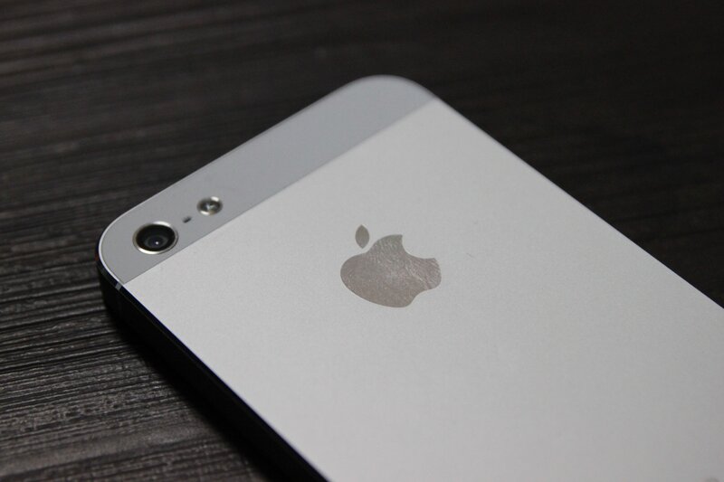 silver iPhone on dark surface