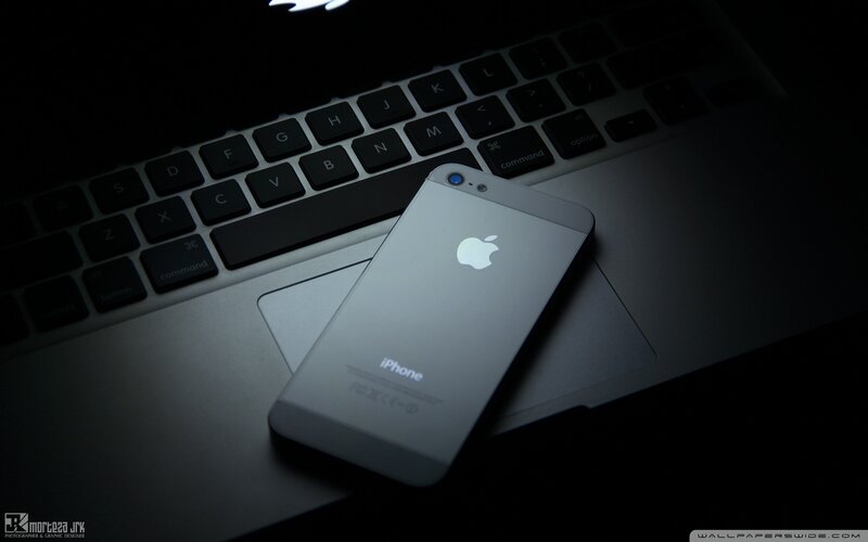 Silver IPhone on Laptop — Black