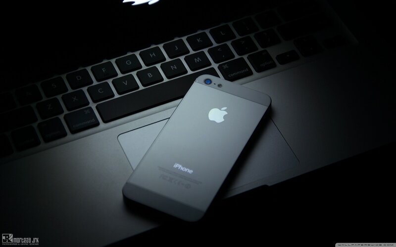 Silver IPhone on Laptop
