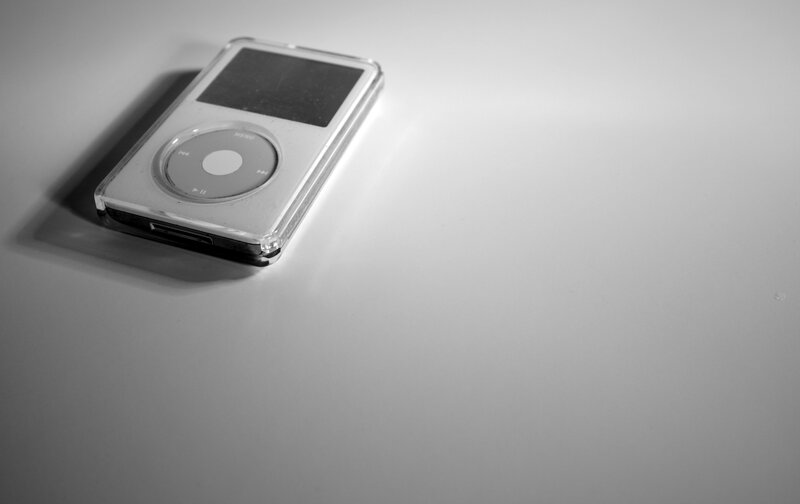 silver ipod on white surface