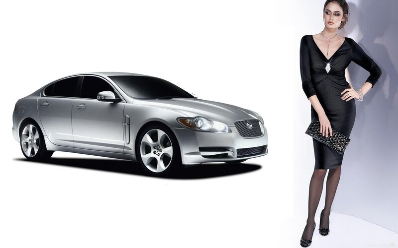 silver jaguar and woman in black dress