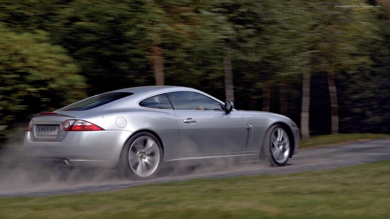 silver jaguar car in motion