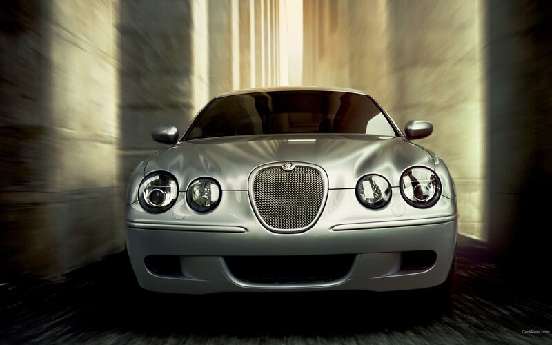 silver jaguar car in tunnel