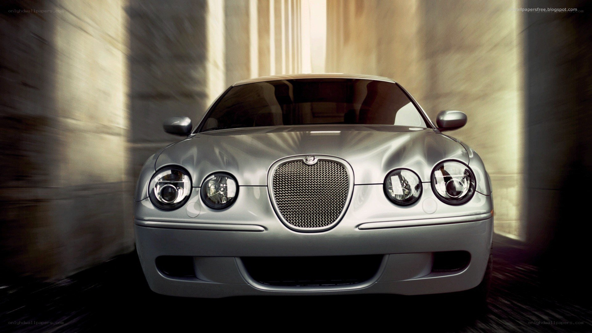 silver jaguar car in tunnel
