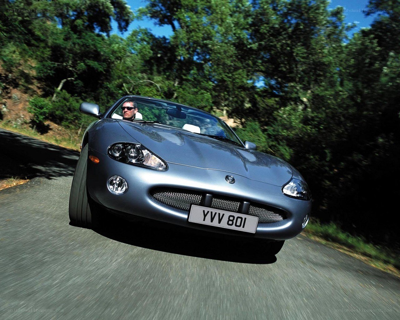 silver jaguar car on road