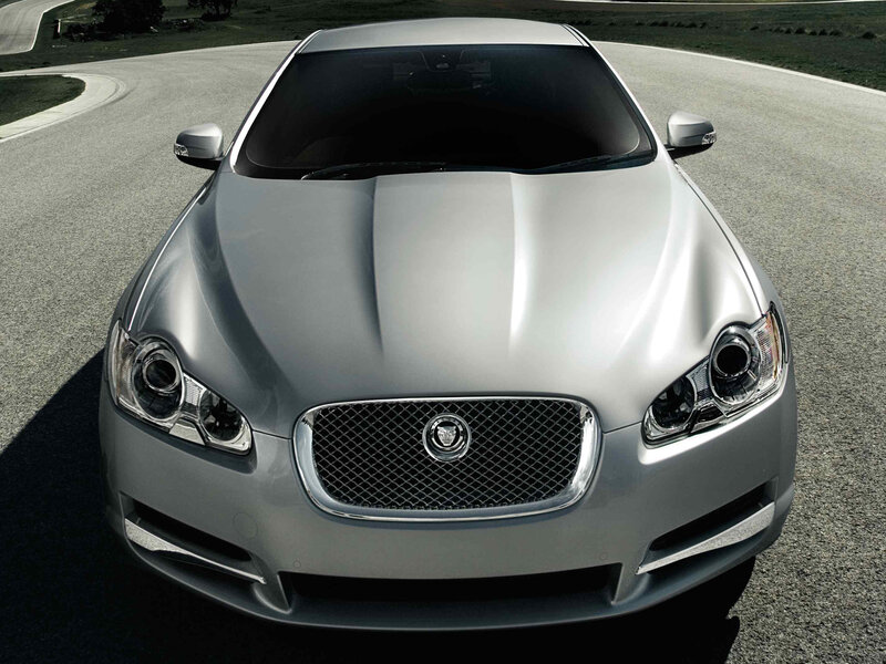 silver jaguar car on road