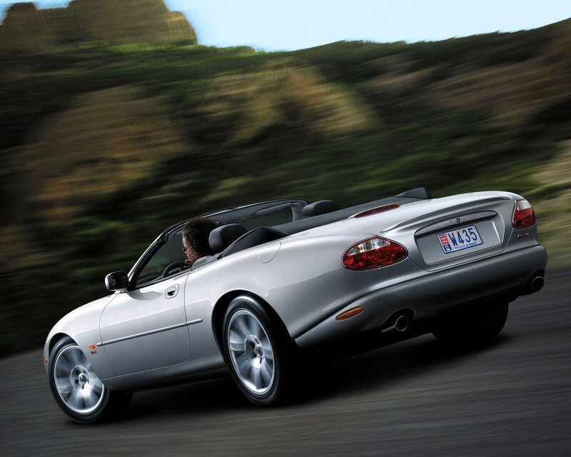 silver jaguar convertible driving