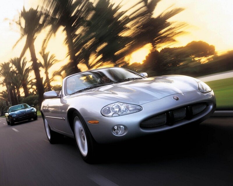 Silver Jaguar convertible in motion