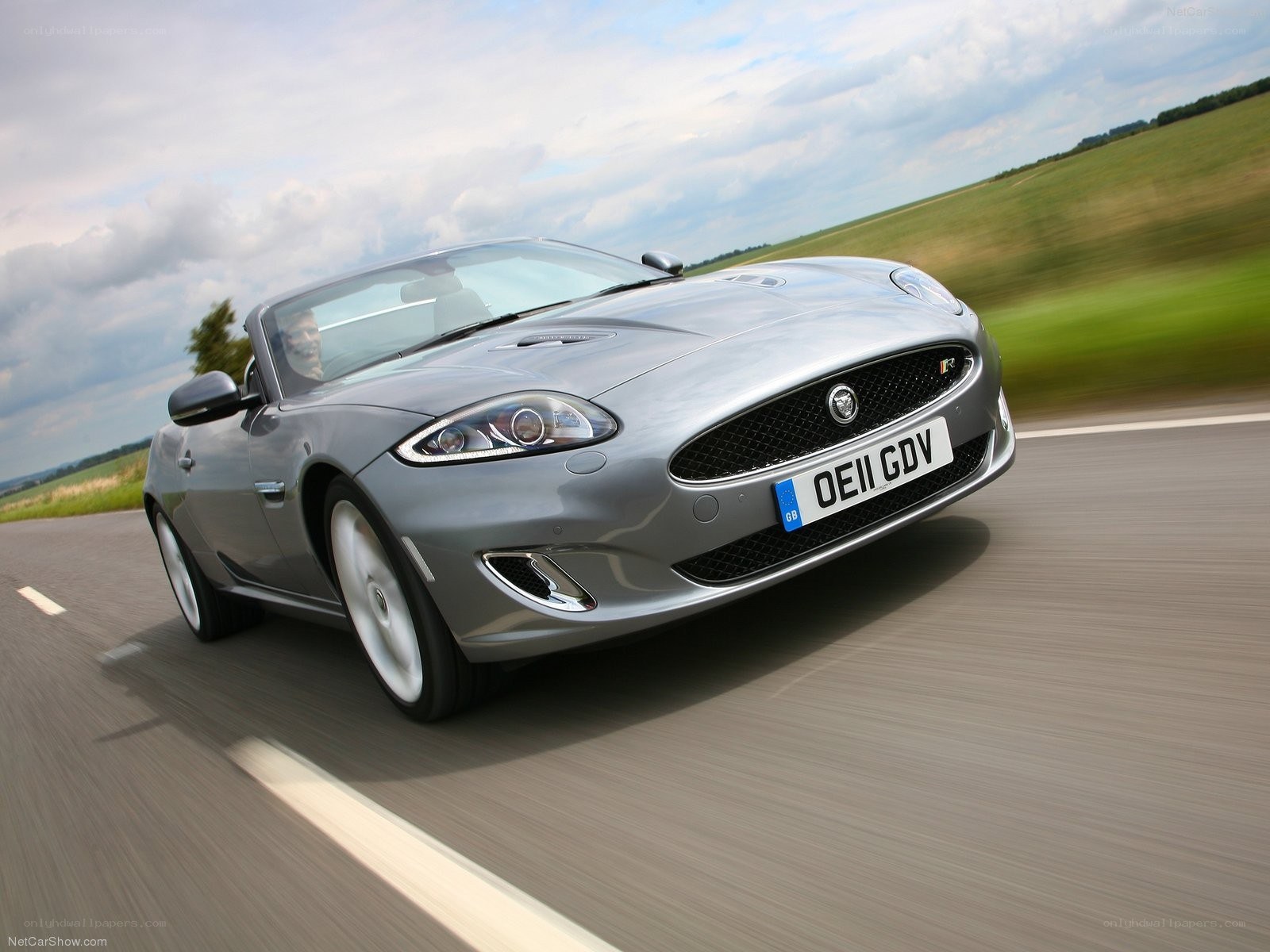 silver jaguar convertible in motion