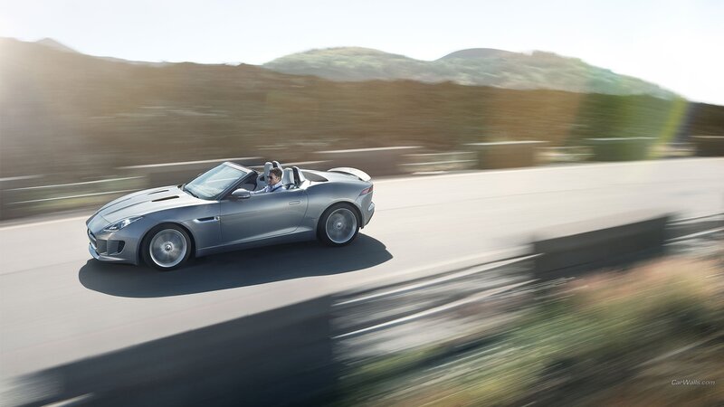 silver jaguar convertible in motion