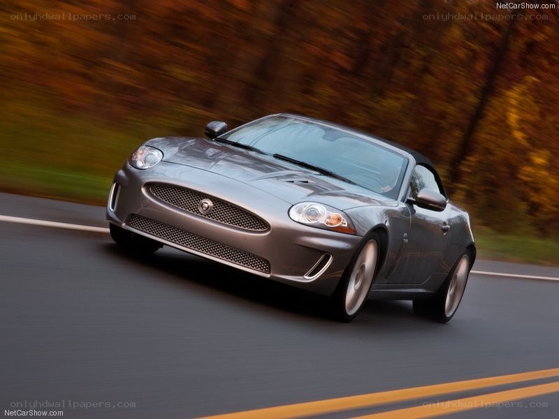 silver jaguar convertible in motion