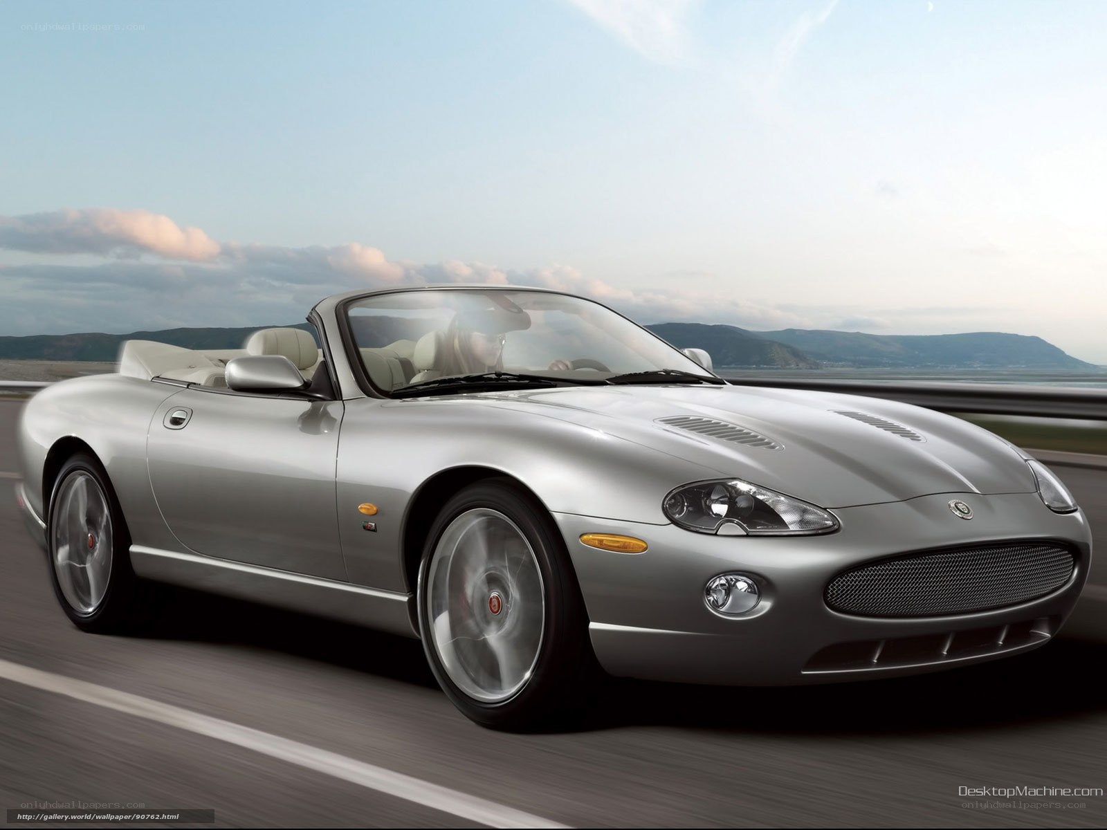 silver jaguar convertible on road