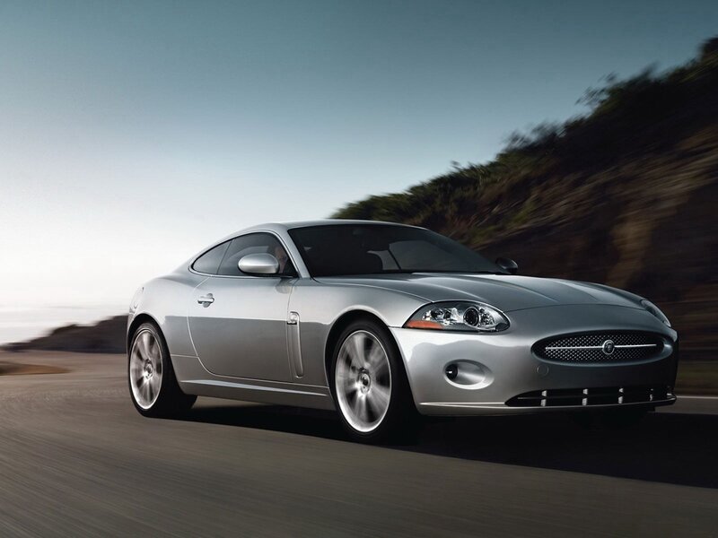 silver jaguar coupe in motion
