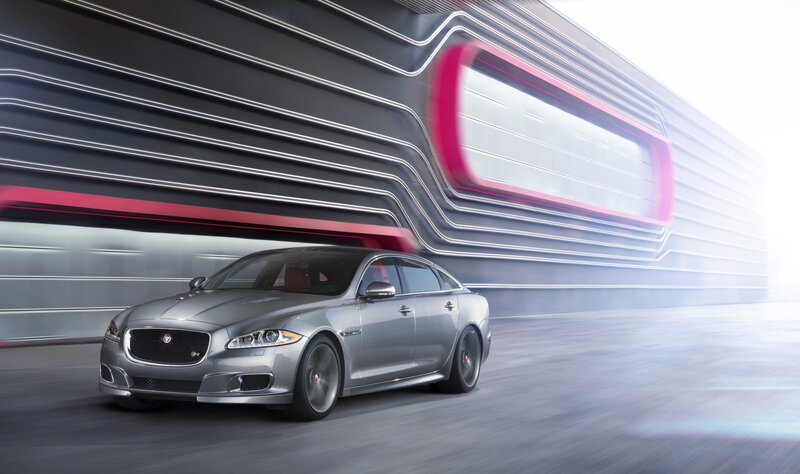 silver jaguar driving fast