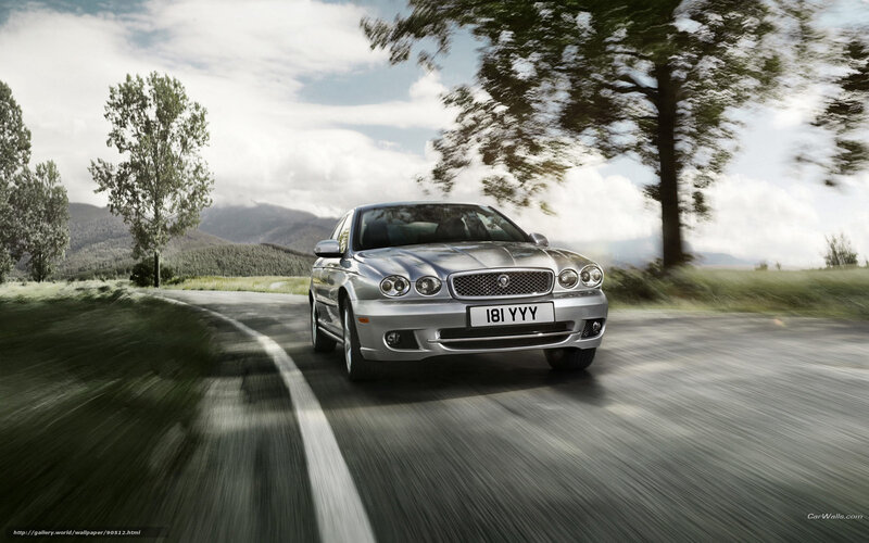 silver jaguar driving on country road