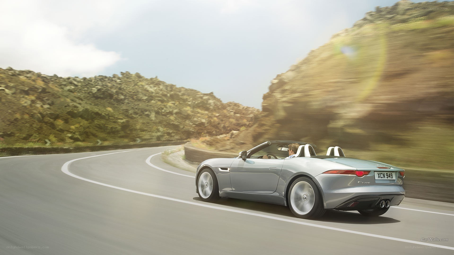 silver jaguar f-type driving