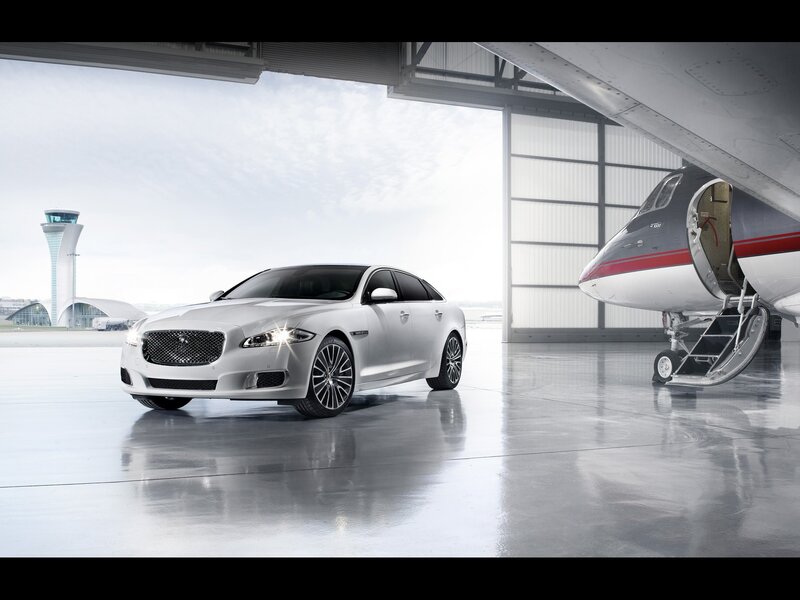Silver Jaguar in airport hangar