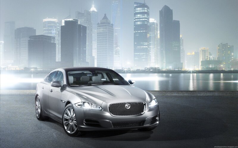 Silver Jaguar in cityscape
