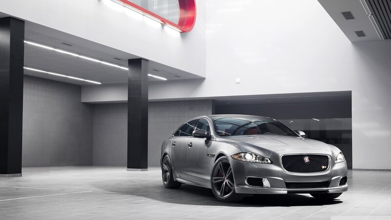 Silver Jaguar in modern showroom