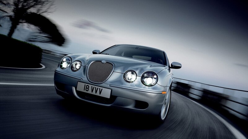 silver jaguar in motion