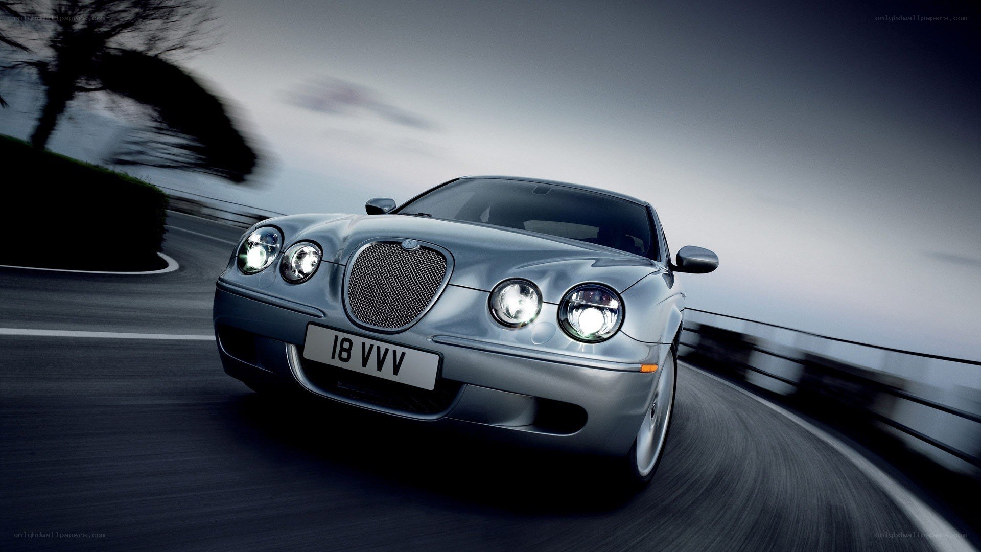 silver jaguar in motion