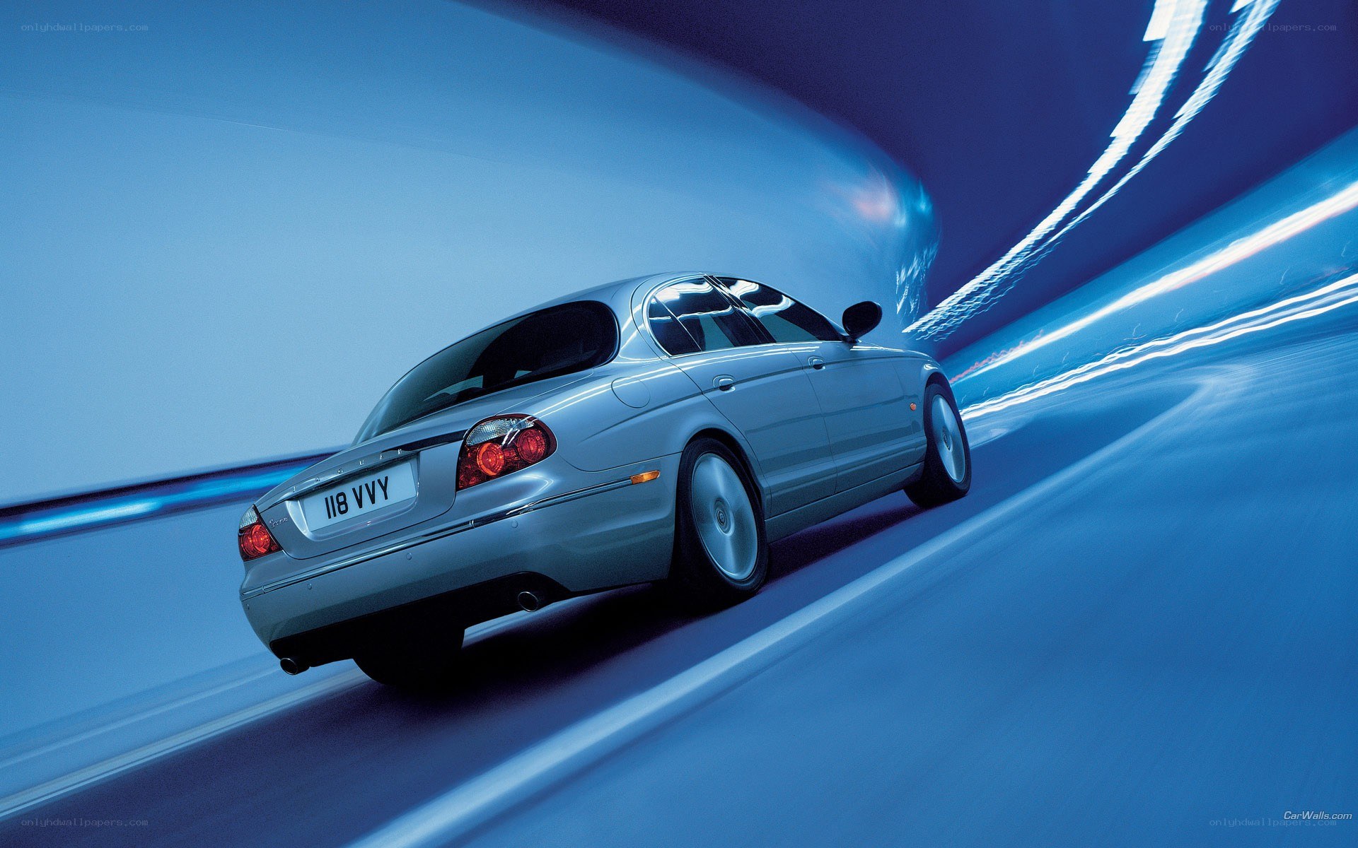 silver jaguar in motion