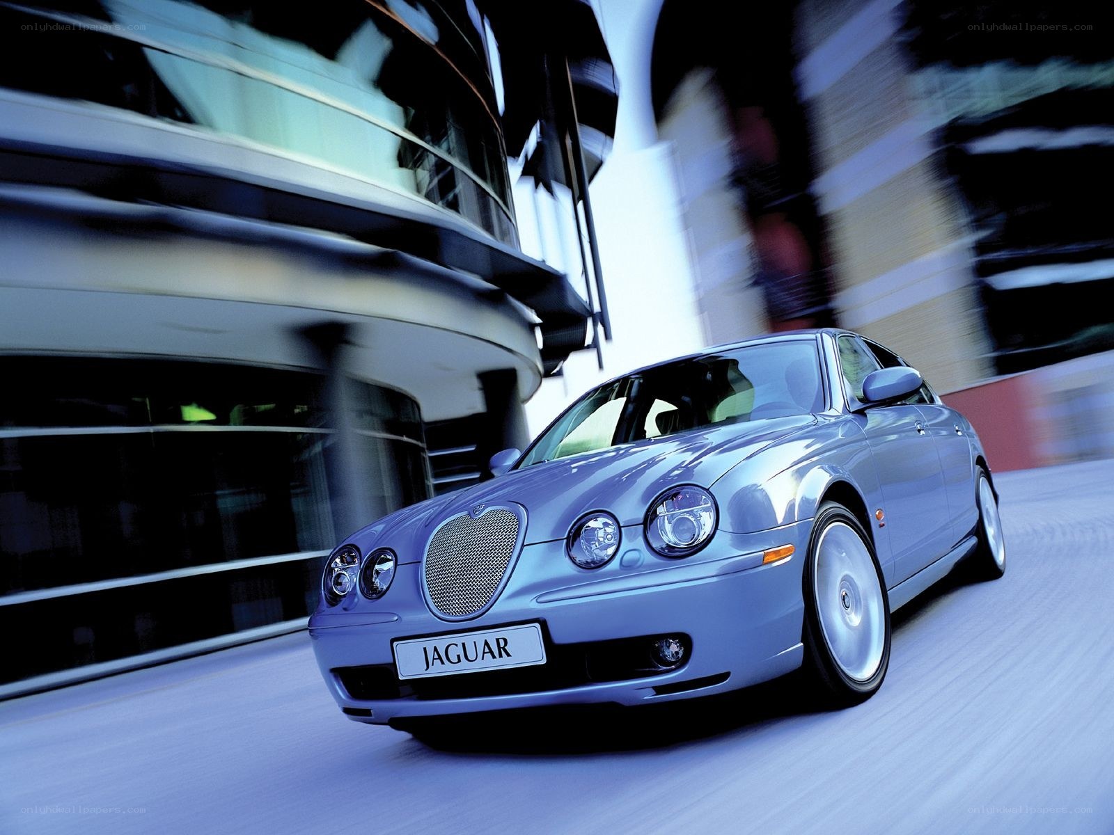 Silver Jaguar in motion