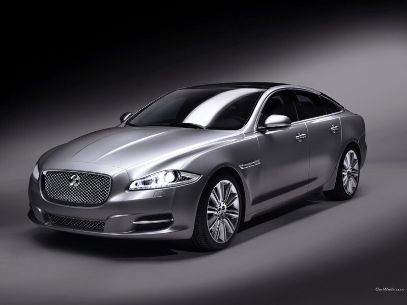Silver Jaguar Luxury Sedan — Dramatic