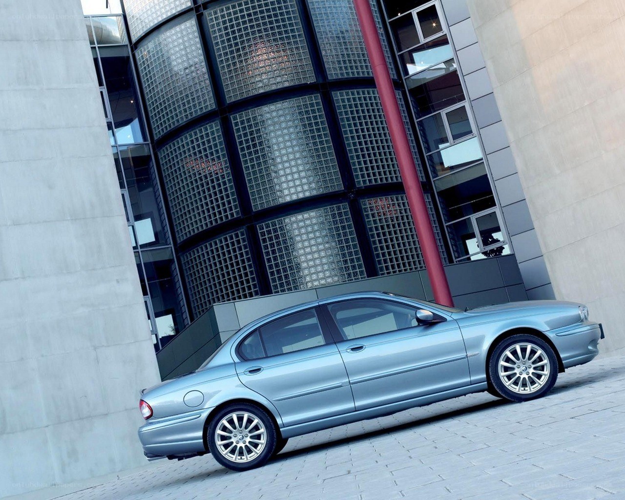 silver jaguar sedan parked
