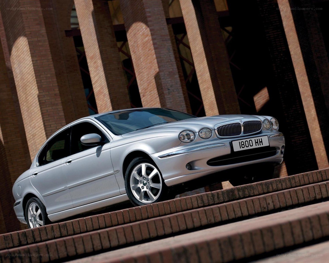silver jaguar x-type on steps