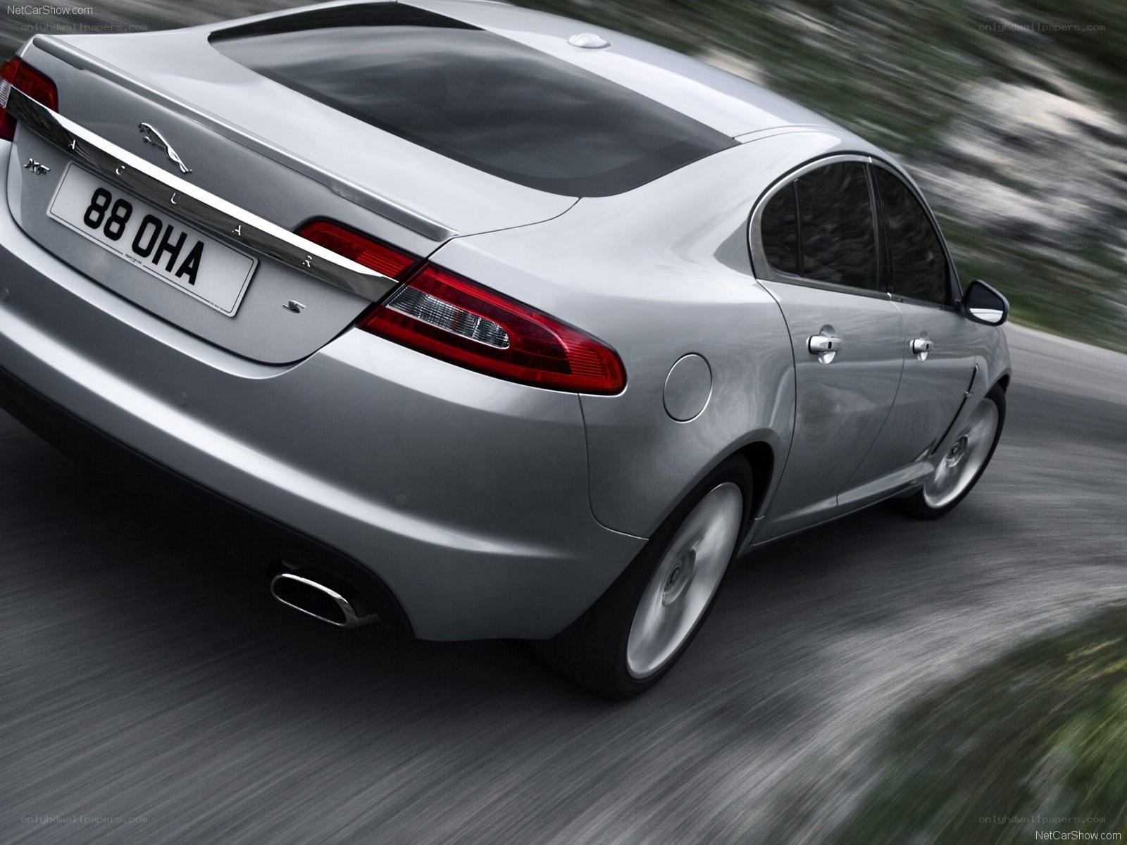 silver jaguar xf in motion