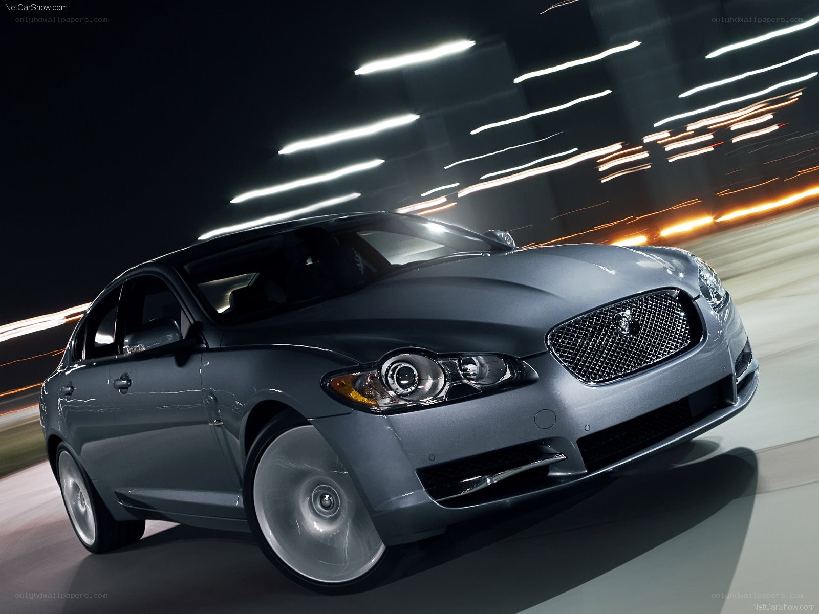 silver jaguar xf in motion