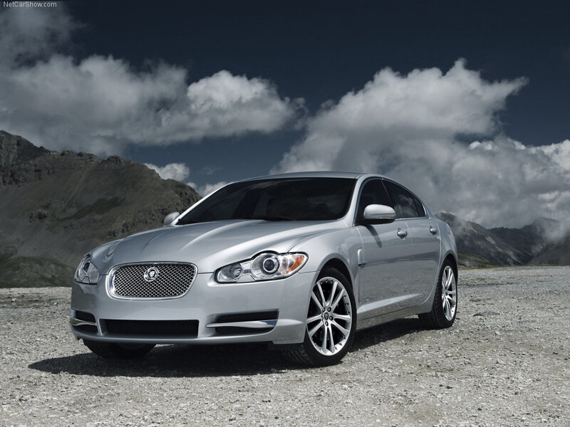 Silver Jaguar XF on a mountain road