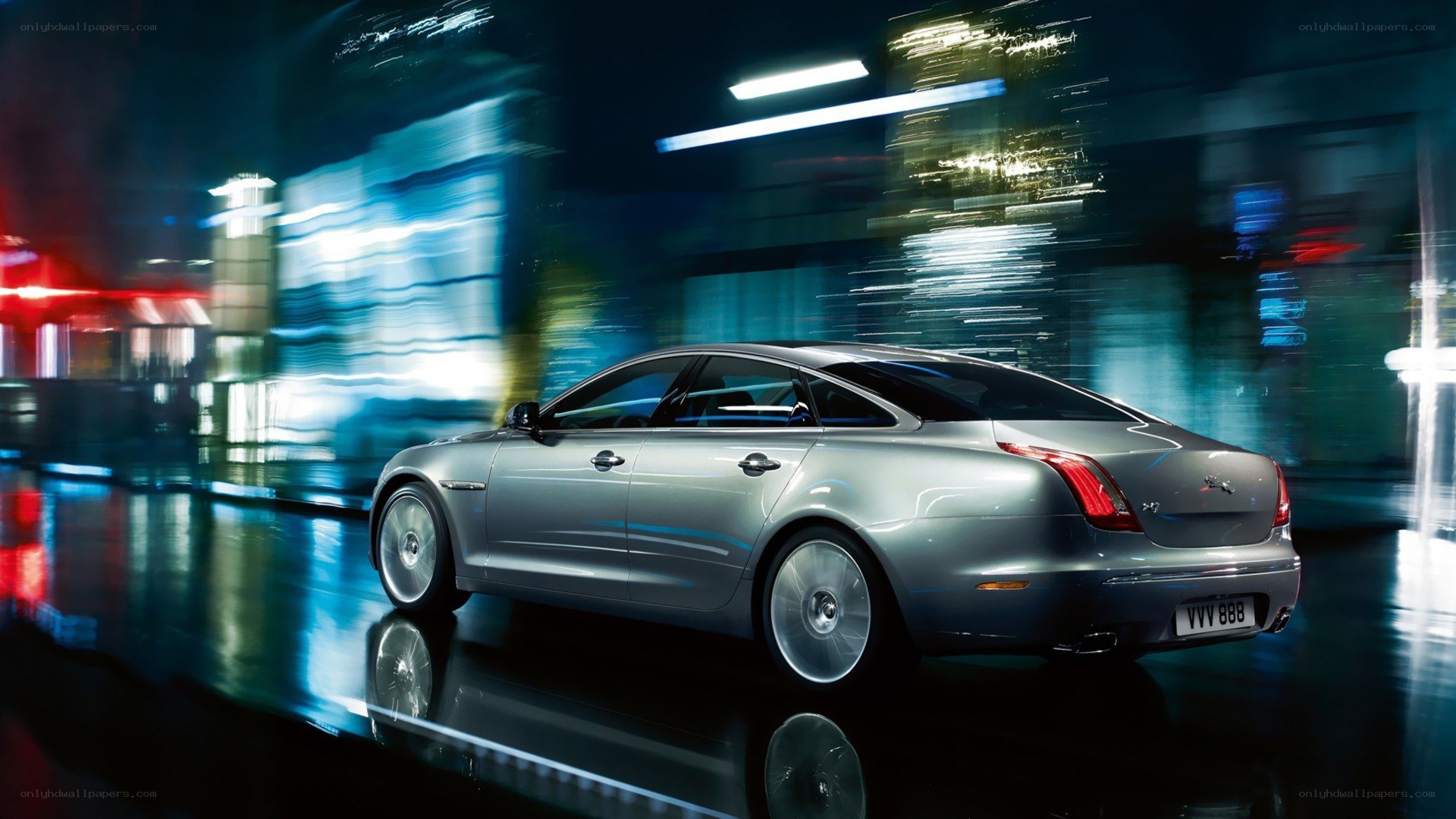 silver jaguar xj at night