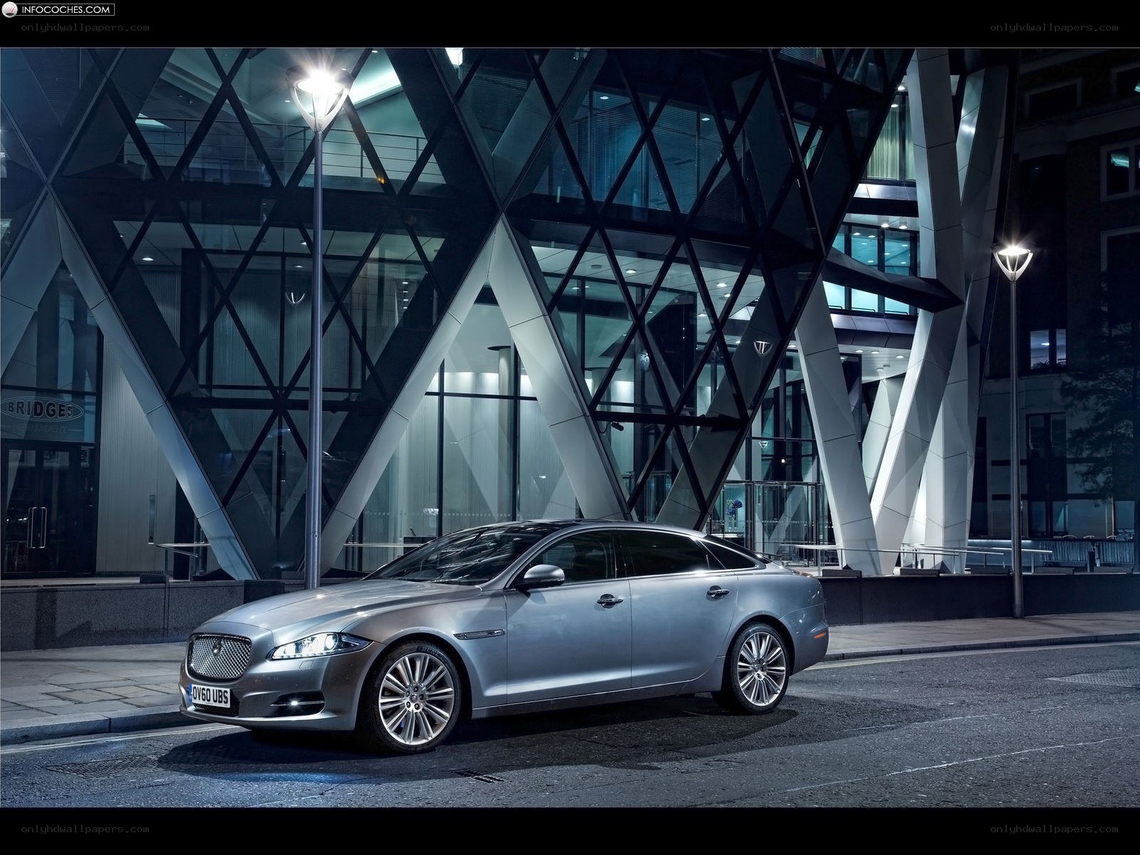 Silver Jaguar XJ at night