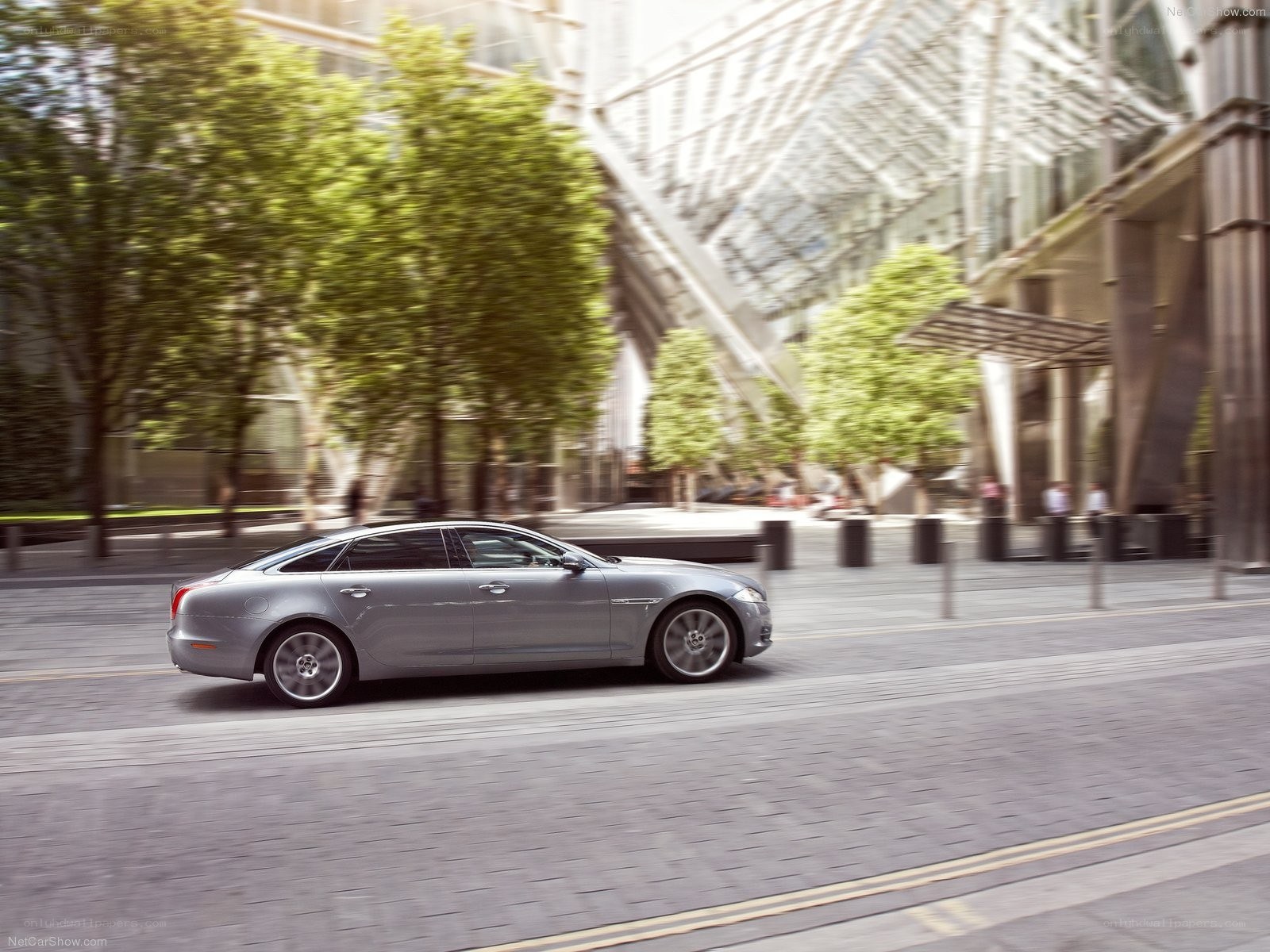 silver jaguar xj in motion