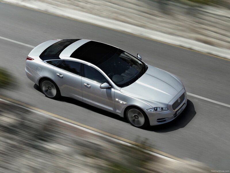 silver jaguar xj in motion