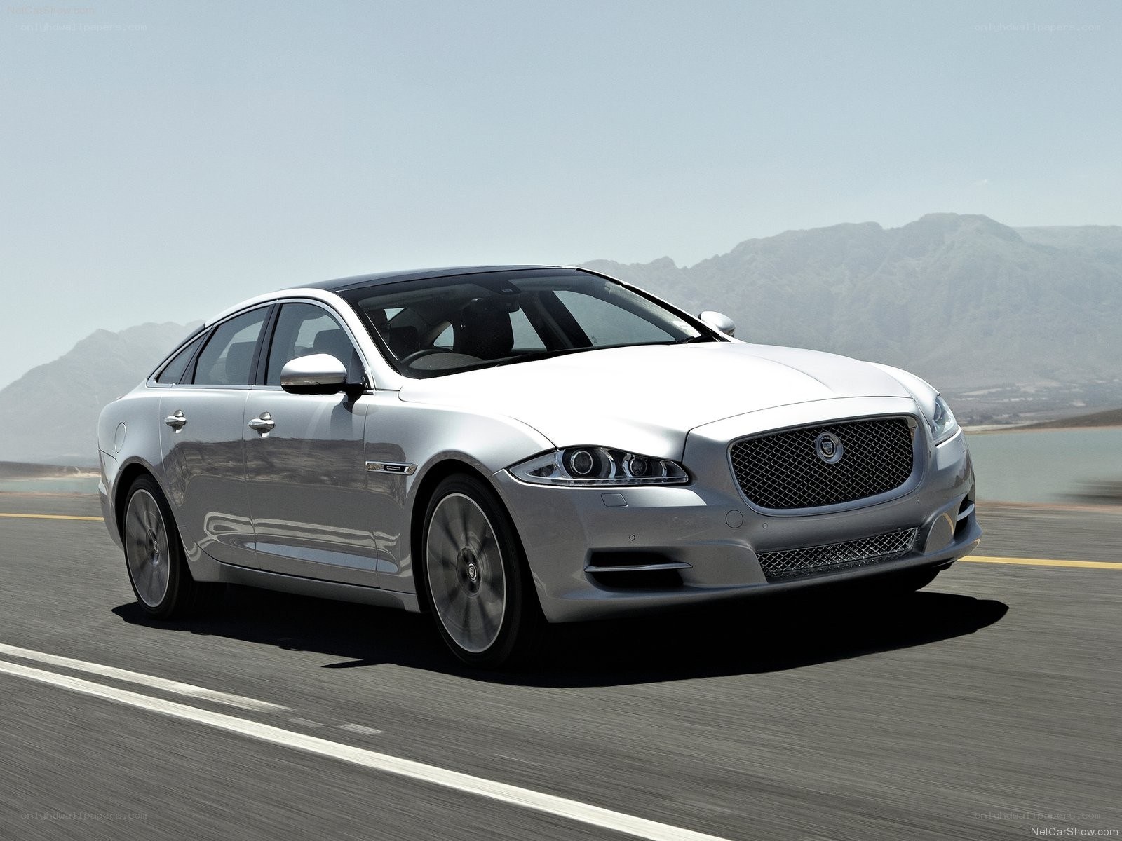 silver jaguar xj in motion