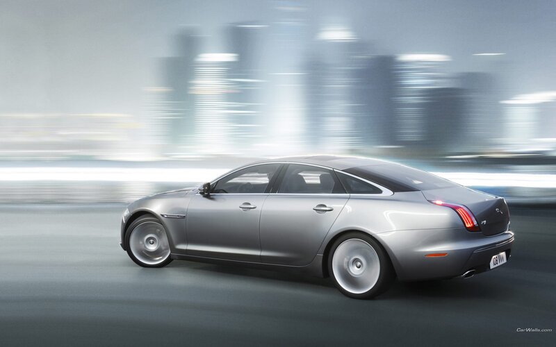 silver jaguar xj in motion
