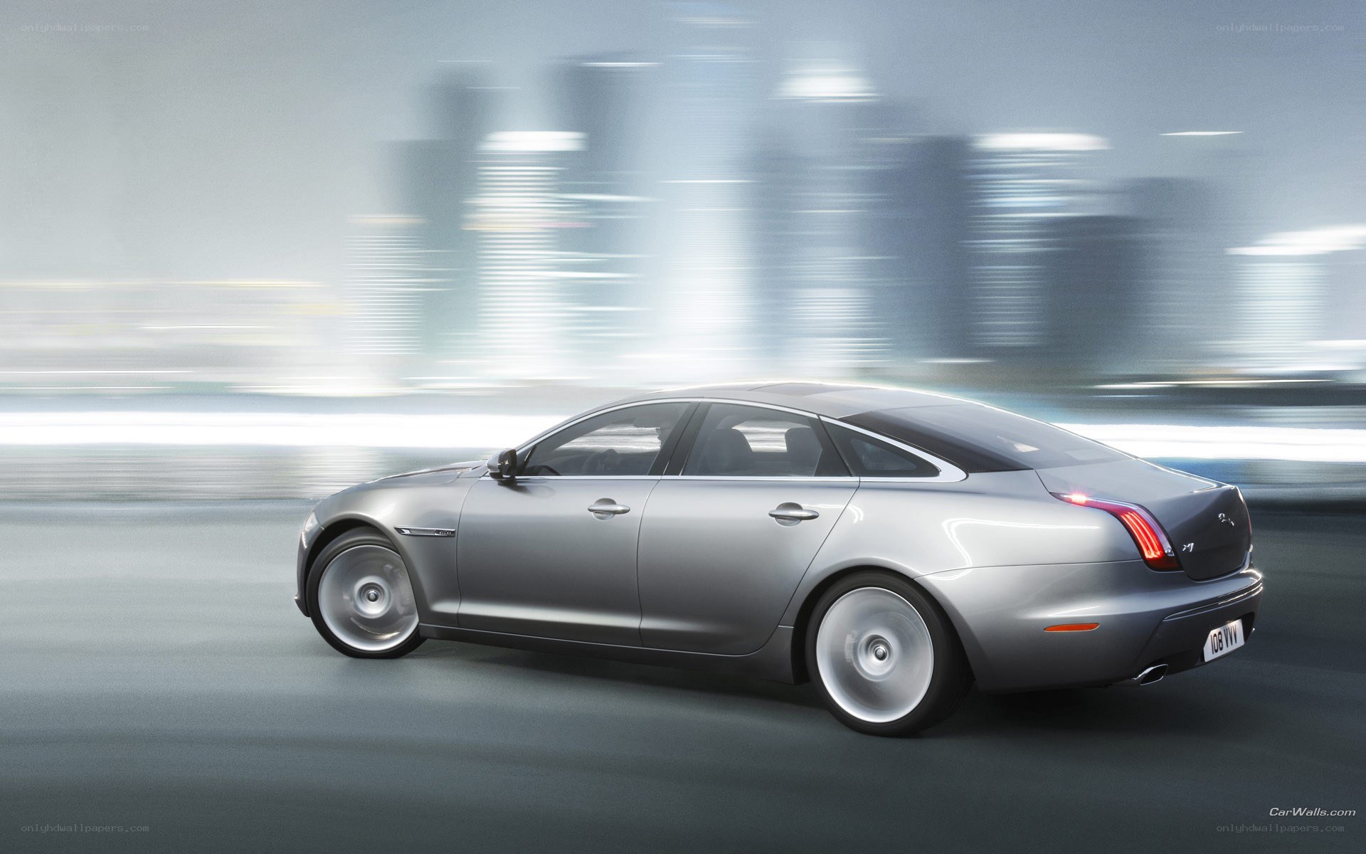 silver jaguar xj in motion
