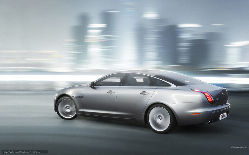 silver jaguar xj in motion