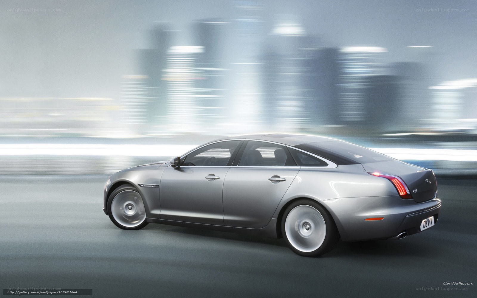 silver jaguar xj in motion