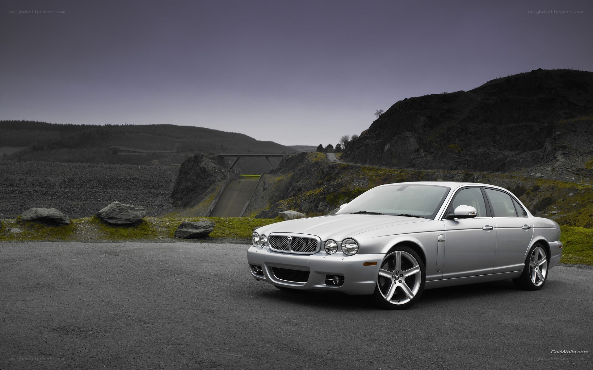 silver jaguar xj on a road